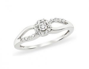 White-gold ring with center diamond with 18 additional round-cut diamonds.jpg